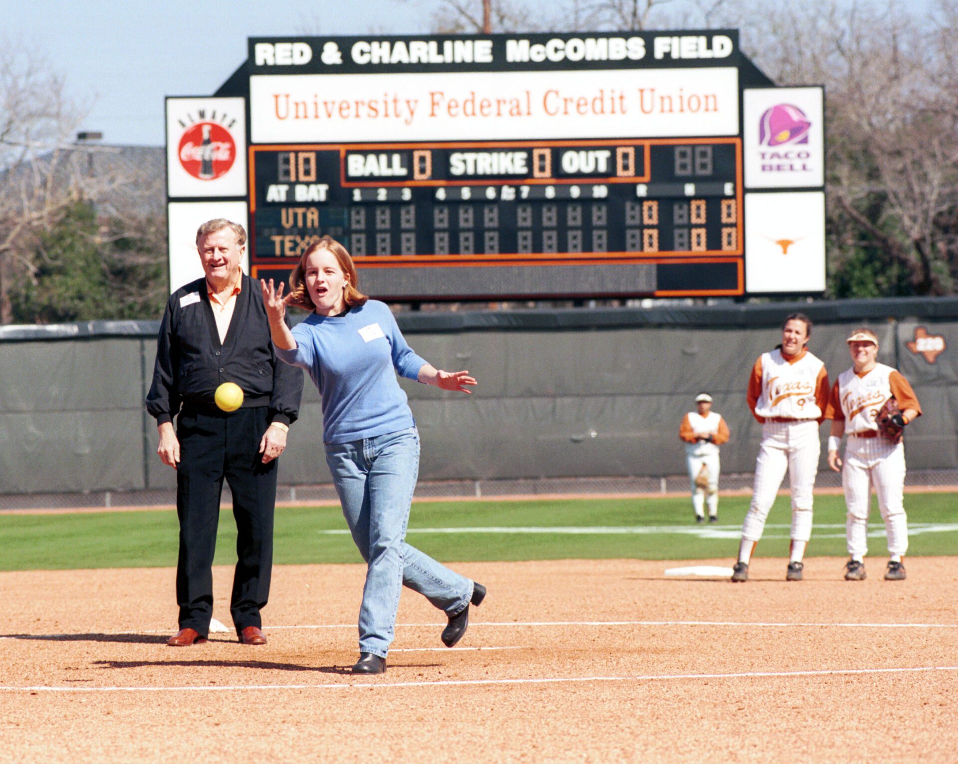 A McCombs granddaughter throws the first pitch at Red and Charline McCombs Field